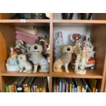 A collection of twelve 19th century and later Staffordshire figures and dogs (12) (part af)