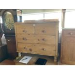 A pine chest of two short over two long drawers, on bun feet, width 103cm, depth 41cm, height 93cm.
