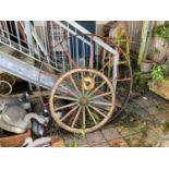 BLACKSTONE; a large cast iron cart wheel, with five wooden framed and iron cart wheels (6)