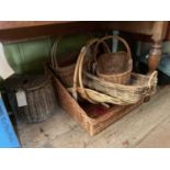 A vintage fishing basket together with a selection of wicker baskets and display stands.