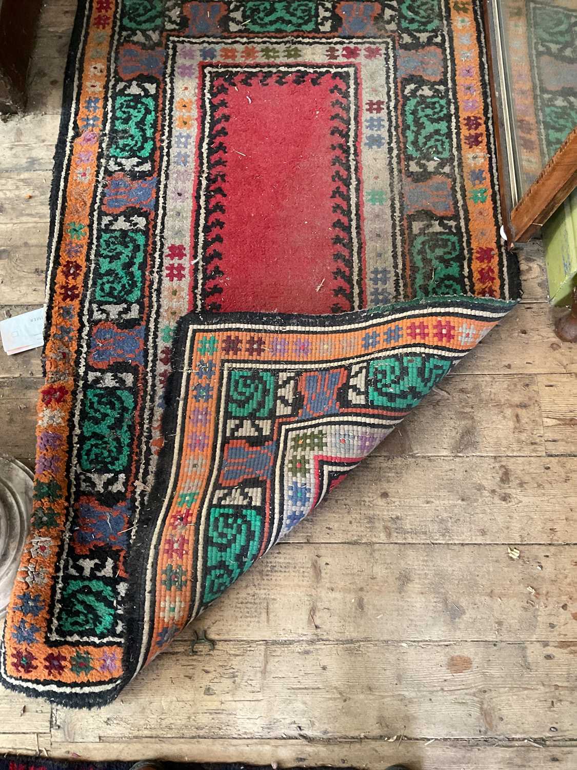 A decorative rug with floral decoration in shades of orange, green, red, black and white, 156 x - Image 2 of 4