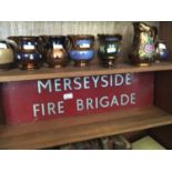A Merseyside Fire Brigade tin sign, 24 x 80cm.