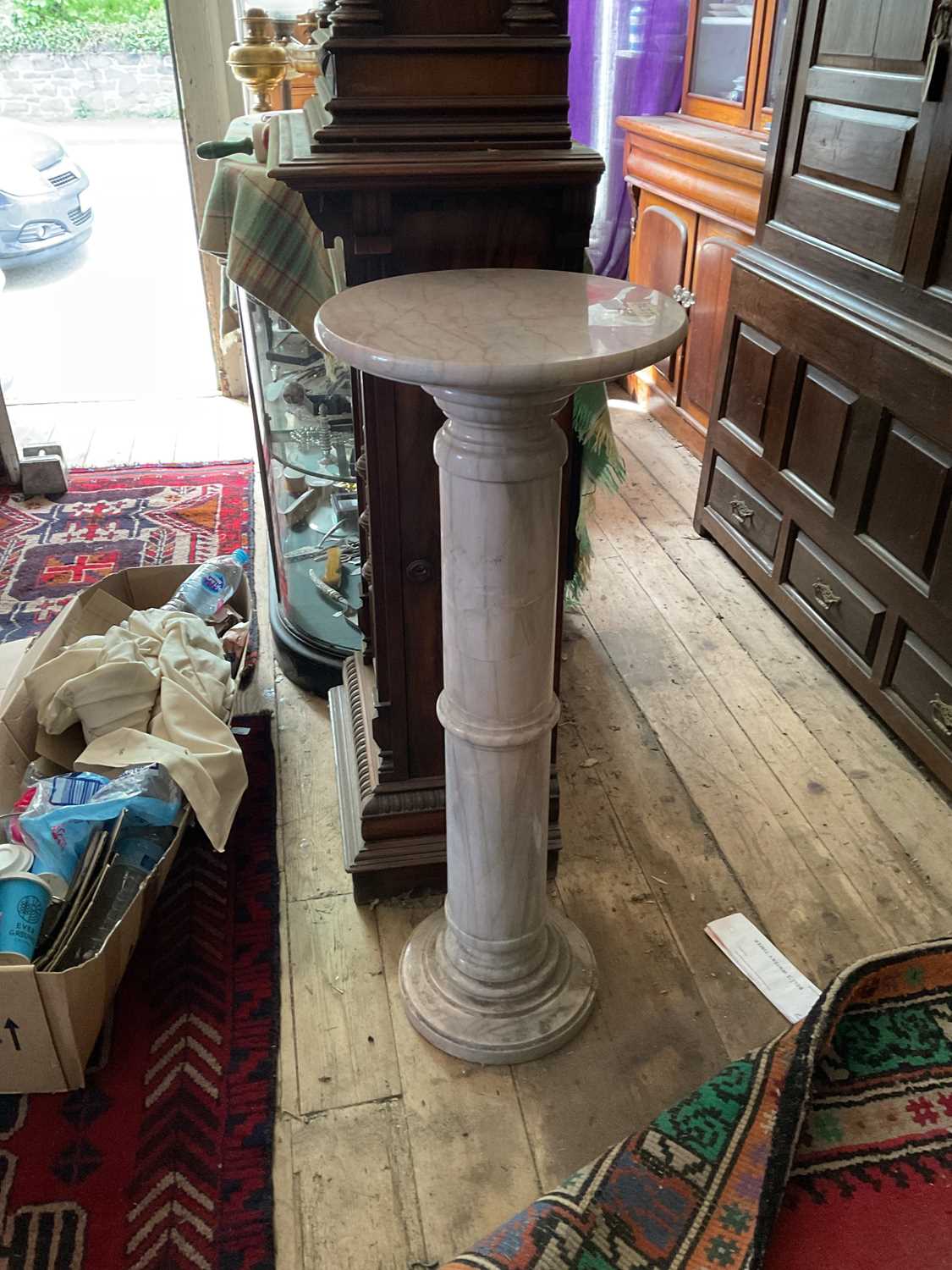 A decorative marble column, height 100cm, diameter of top 37cm.Provenance: Appears to be in fair