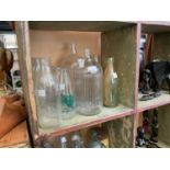 A mixed lot of bottles to include poison, cod bottles, sauce examples, a baby feeder, and a