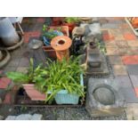 A large quantity of garden related items, including a cast iron water pump, terracotta finials,