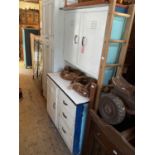 A 1950s enamel and painted wood kitchen cabinet with an arrangement of three doors and three