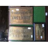 Three brass advertising wall plates, including Gilbert E. Shaw Solicitor, Crosby Nursing Centre, etc