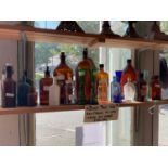 A small collection of assorted bottles to include poison examples.