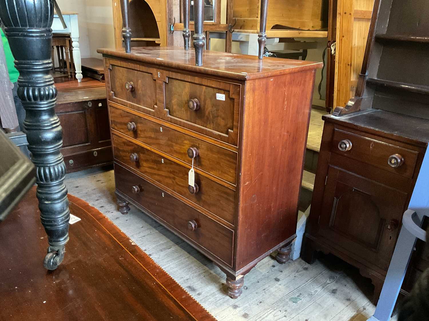 A 19th century mahogany chest of four drawers, with turned bun handles, on bun feet, width 126cm,