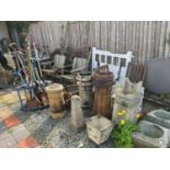 A collection of assorted garden related items, including chimney pots, garden tools, white painted