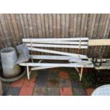 Three iron/metal framed garden benches with wooden slatted seats.