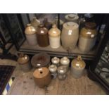 A collection of assorted stoneware to include whisky barrels, flagons, hot water bottles, also an