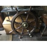 A brass bound oak ship's wheel, diameter 106cm.