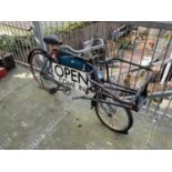 A vintage postman's bike, with later applied sign 'Open Come In'.