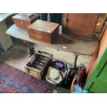 A Victorian garden table with later wooden top, the cast iron base with pierced decoration, length