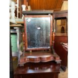 A 19th century mahogany serpentine fronted dressing table mirror, height 63cm.