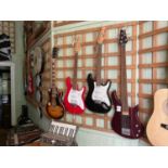 Three electric guitars, including a Peavey example, and a five string bass guitar (4)Condition