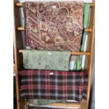 A collection of textiles, including Welsh blanket, rug with stylised floral decoration, etc.