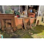 Three cast iron fireplaces, with assorted fire implements, dog grate, fire fronts, etc.