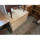 A vintage pine blanket chest with iron handles, on plinth base, width 94cm, depth 53cm, height 60cm.