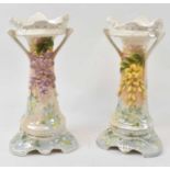 A pair of Continental floral encrusted mantel ornaments, height 36.5cm.Condition Report: Loses to