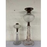 Two cut glass oil lamps, height of tallest 52cm.