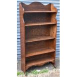 An oak waterfall type bookcase, width 76cm, height 147cm.