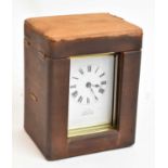 A brass cased carriage clock in leather travelling case.