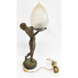 An Art Deco spelter table lamp modelled as a semi-naked female, her hands outstretched supporting