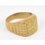 A yellow metal gents ring, stamped 18k, size U, approx 12.4g.