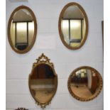 A pair of gilt framed wall mirrors, 72 x 45cm, and two other gilt framed mirrors (4).