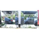 A pair of modern bevelled glass wall mirrors, 100 x 100cm.