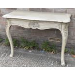 A contemporary painted console table with scroll detail to the shaped frieze and legs, width 110cm.