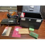 SINGER; a rare 222K sewing machine, cased, with accessories and manuals.