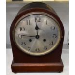 A mahogany cased mantel clock with silvered dial, height 31cm.