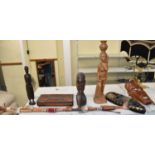 A small collection of tourist ware tribal art carvings including two masks, three figures, etc (8).