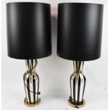 A pair of contemporary black, cream and gold table lamps with brass bases and black shades, height