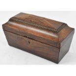 An early 19th century mahogany sarcophagus form tea caddy for restoration, width 33cm.