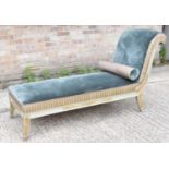 A contemporary Regency style pale green and gold painted and upholstered scroll end day bed.