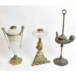 A Wild and Wessel type oil lamp, an Empire style brass and opaque glass oil lamp, and a brass lamp
