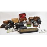 A quantity of cameras and equipment including Kodak box cameras, Kodak film tank, development box