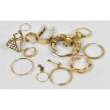A group of scrap jewellery including a 14ct yellow gold earring, two 9ct yellow gold earrings, two