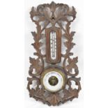 An early 20th century Black Forest style wall barometer/thermometer, height 43cm.