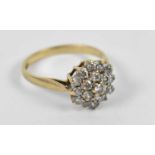 A 9ct yellow gold ring set with approx eighteen white stones, size J, approx 2g.