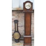 An early 20th century carved oak wall barometer/barometer, the dial marked Selfridge London, and a