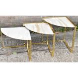 A contemporary nest of three brass and travertine marble curved corner occasional tables.