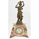 An early 20th century French eight day mantel clock surmounted with spelter figure of a female (