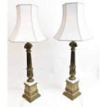 A pair of brass style and white marble table lamps, height 64cm to top of fitment.