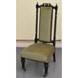 A late Victorian ebonised side chair with barleytwist uprights and turned fluted supports.