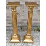 A pair of 20th century giltwood columns, height 86cm.